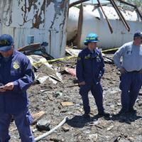 NRT agents standing at an investigation site