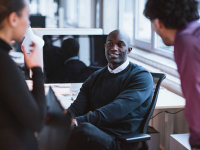 Three diverse attorneys having a discussion