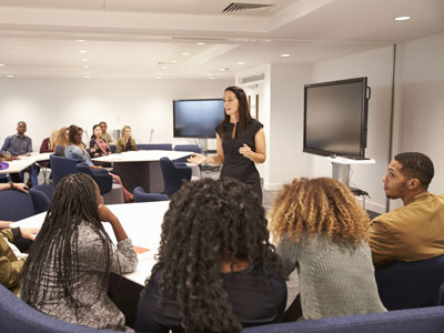 Instructor speaking with a group