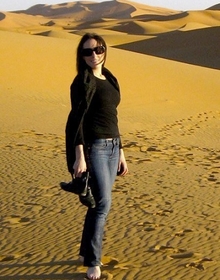 Cara standing in the desert