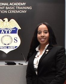 Mariah posing in front of a large ATF badge