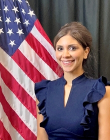 Melissa in front of a U.S. flag