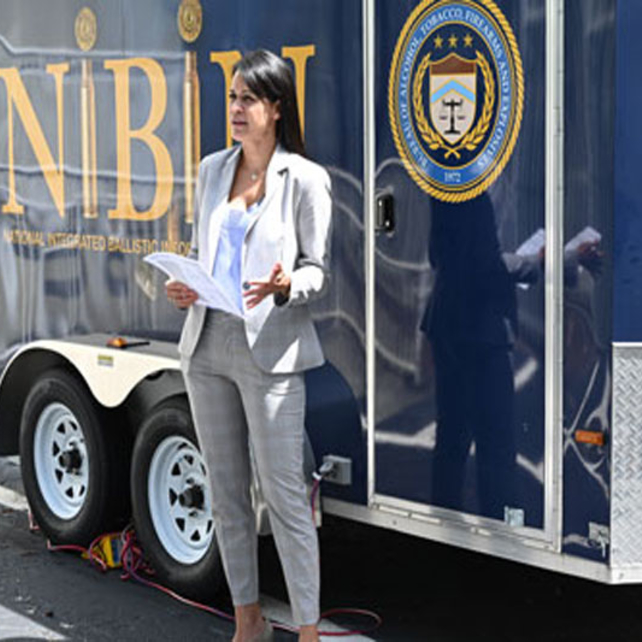 Supervisory Special Agent Jelissa Orcinolo in front of the NIBIN trailer