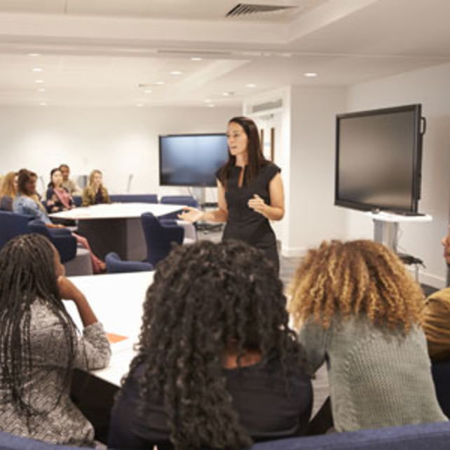 Instructor speaking with a group