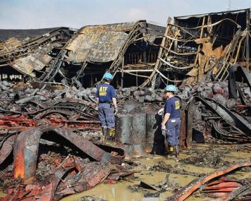 Certified Fire Investigators examining a scene