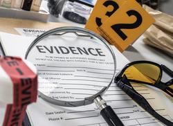 Magnifying glass on top of evidence