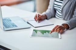 Woman working on financial reports