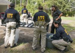 ATF agents taking inventory of guns seized