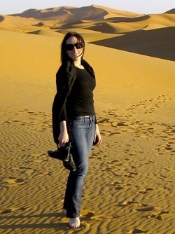 Cara standing in the desert