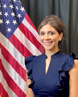 Melissa in front of a U.S. flag